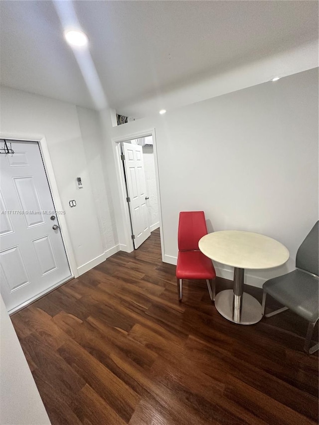 sitting room with dark hardwood / wood-style flooring