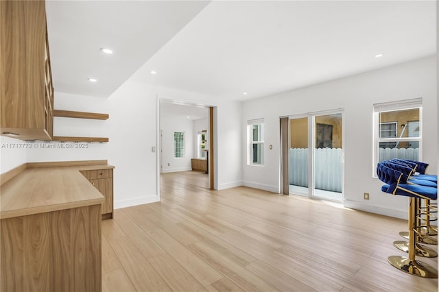 living room with light hardwood / wood-style flooring