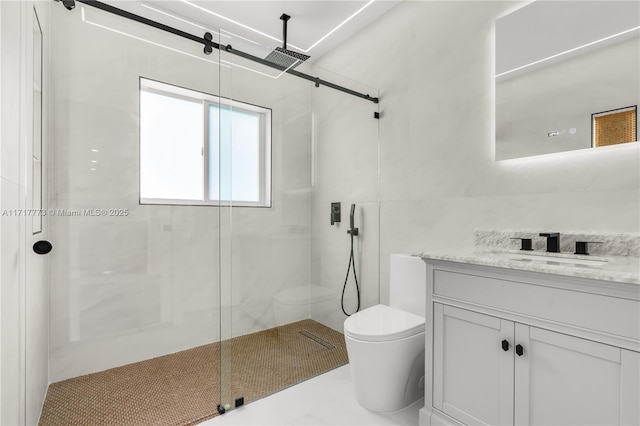 bathroom featuring tile patterned flooring, vanity, toilet, and a shower with shower door