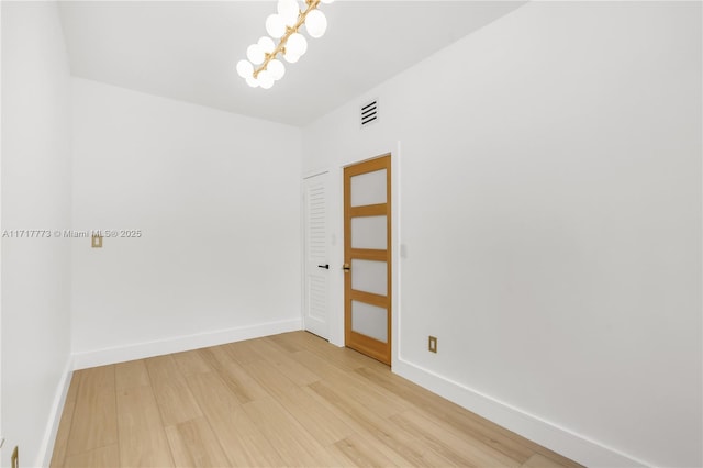 unfurnished room featuring light wood-type flooring