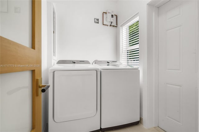 laundry room featuring separate washer and dryer