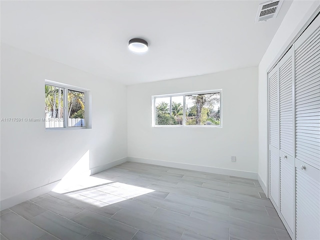 unfurnished bedroom featuring a closet