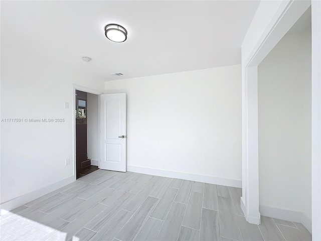 spare room featuring light hardwood / wood-style flooring