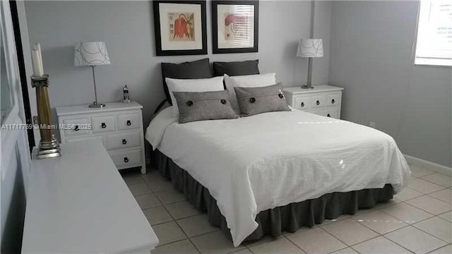 bedroom with light tile patterned floors