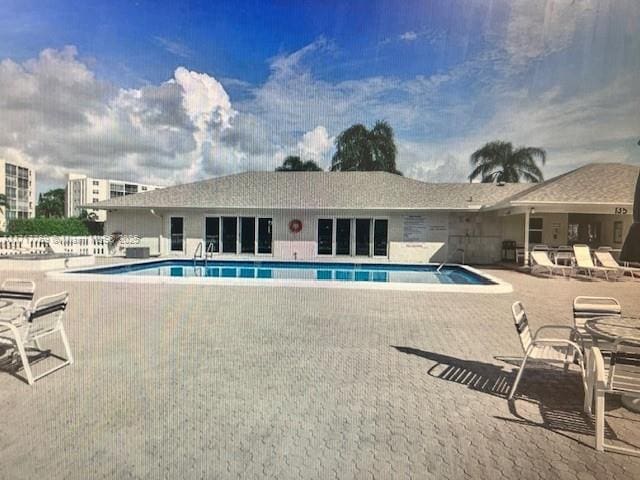 view of swimming pool featuring a patio area