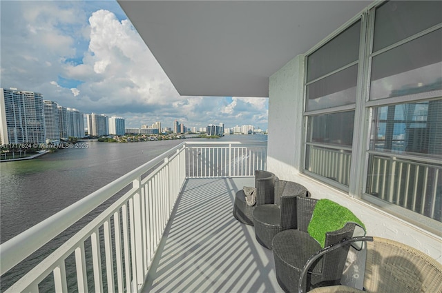 balcony featuring a water view