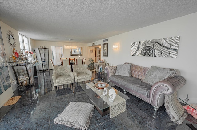 living room featuring a textured ceiling