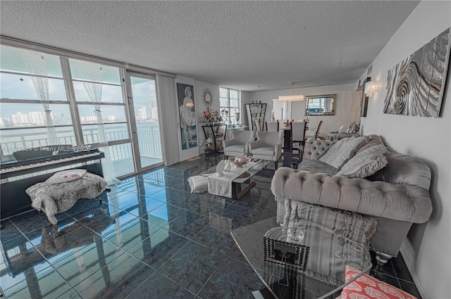 tiled living room featuring floor to ceiling windows, a textured ceiling, and a wealth of natural light