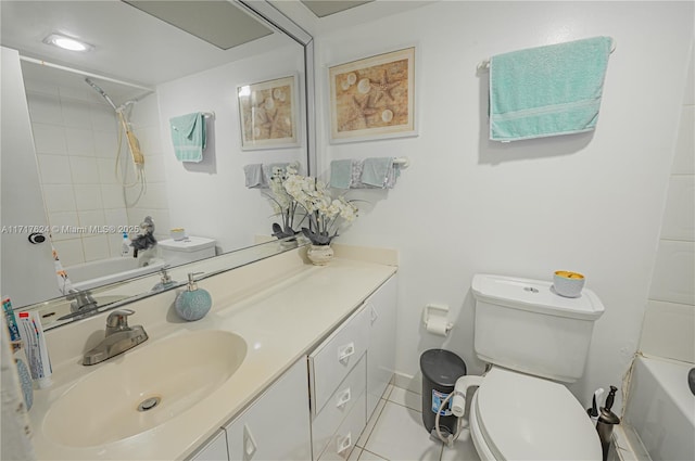 full bathroom with tile patterned flooring, vanity, tiled shower / bath combo, and toilet