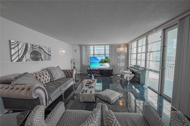 living room with a wealth of natural light, expansive windows, and a textured ceiling