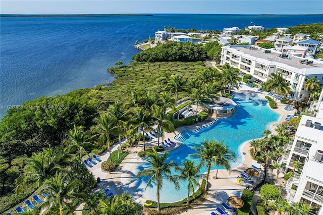 birds eye view of property with a water view