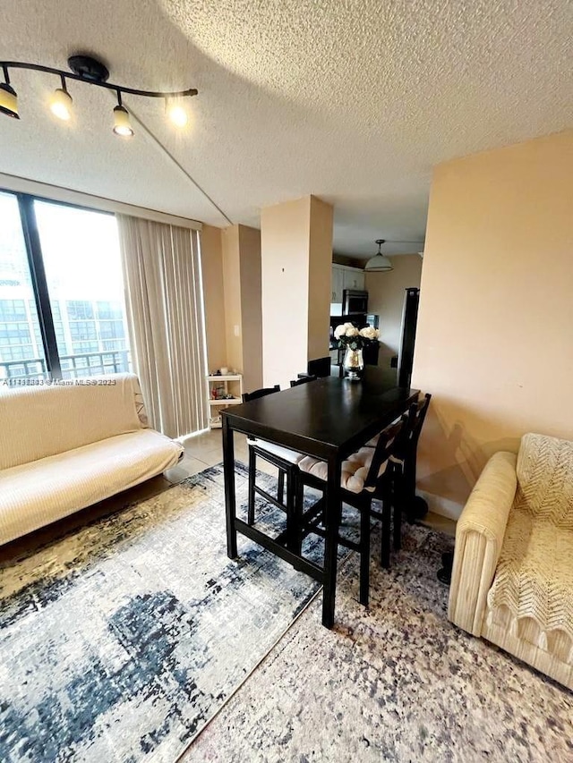 dining room featuring a textured ceiling