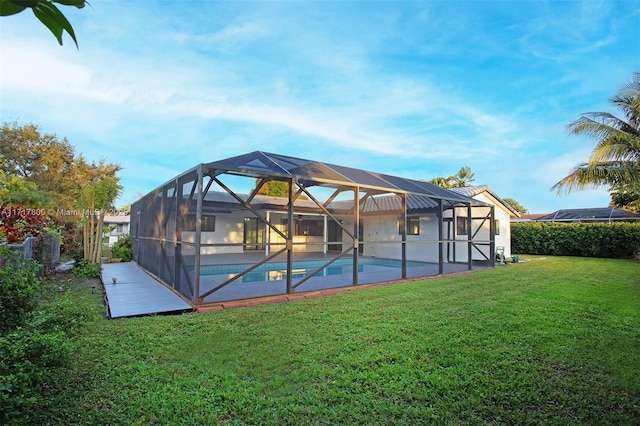 outdoor pool with a yard and a lanai