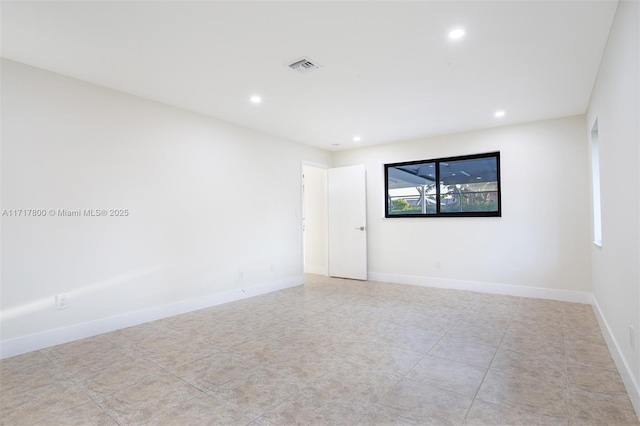 unfurnished room with recessed lighting, visible vents, baseboards, and tile patterned flooring