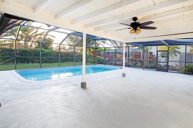 outdoor pool with a patio, fence, a ceiling fan, and glass enclosure