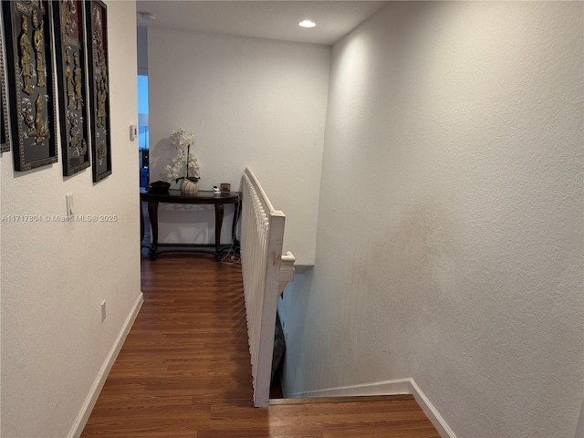 hallway with dark wood-type flooring