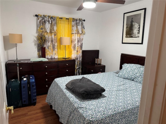 bedroom featuring ceiling fan and dark hardwood / wood-style floors