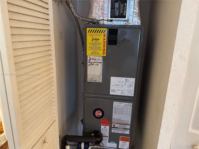 utility room with heating unit