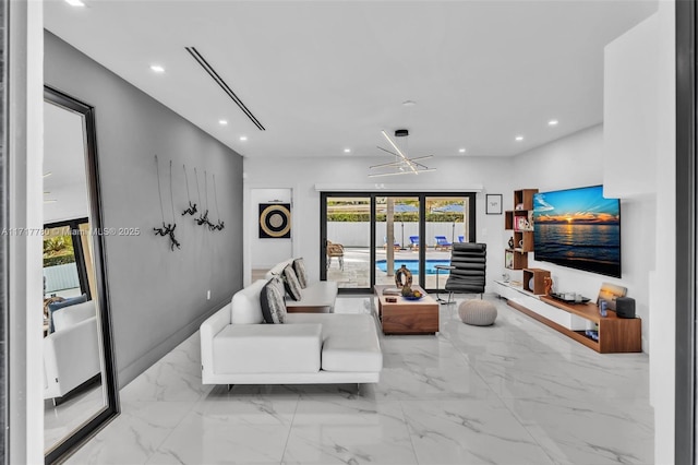 living room featuring a chandelier