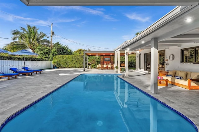 view of pool with outdoor lounge area and a patio area