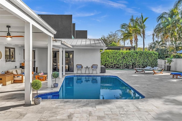 view of pool with an outdoor living space and a patio