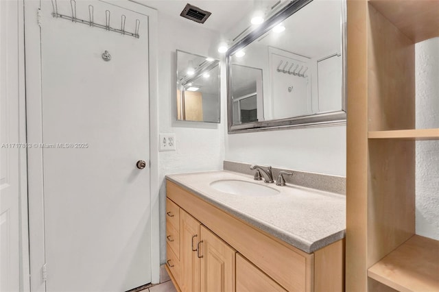 bathroom with vanity and tile patterned floors