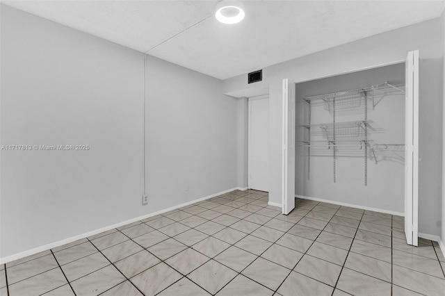 unfurnished bedroom with a closet