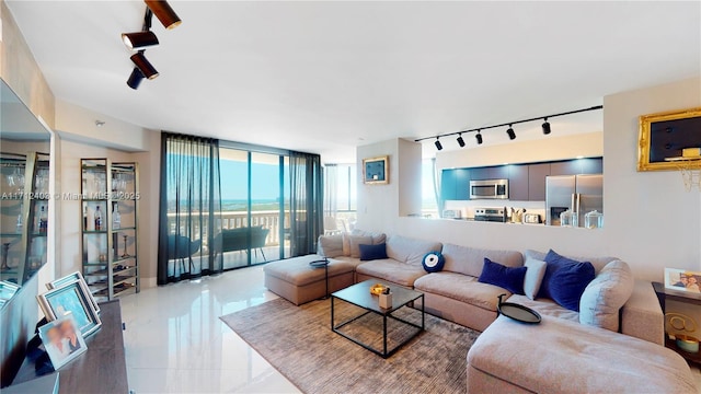 living room with floor to ceiling windows