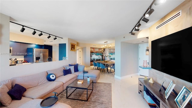 living room featuring an inviting chandelier