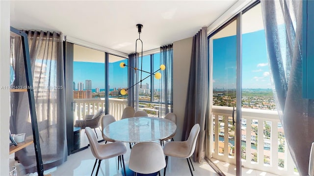 dining space with a healthy amount of sunlight and a wall of windows