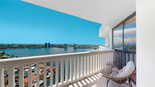 balcony featuring a water view