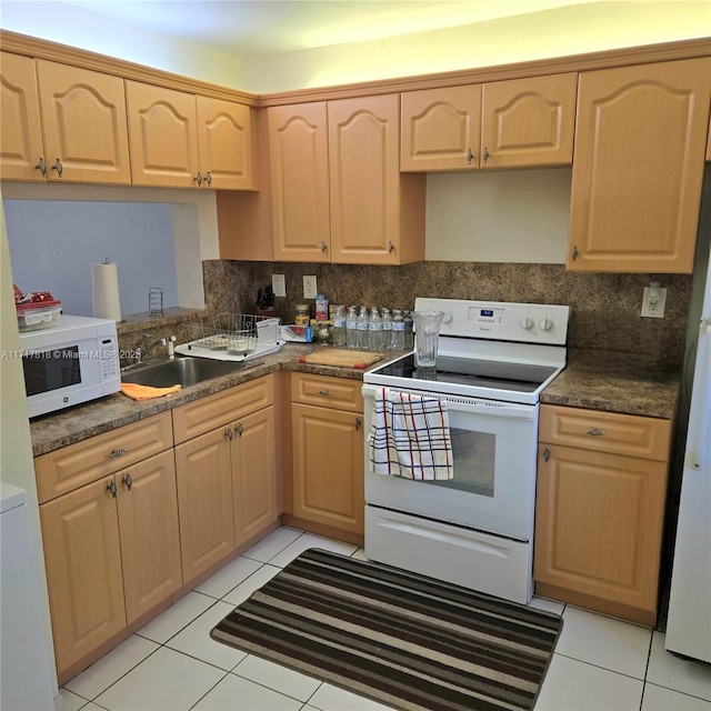 kitchen featuring sink, white appliances, decorative backsplash, light brown cabinetry, and light tile patterned floors