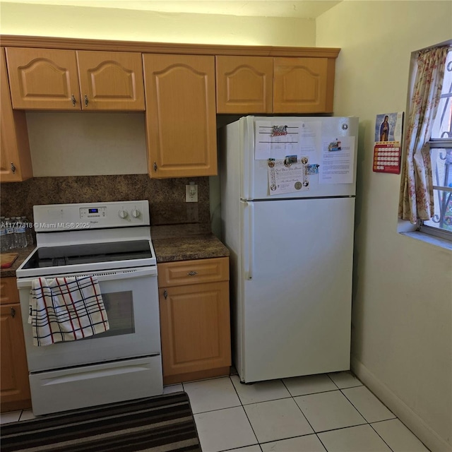 kitchen featuring white appliances, light tile patterned floors, and tasteful backsplash