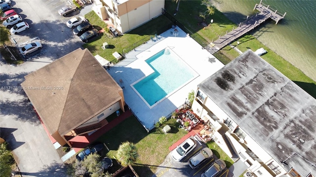 birds eye view of property with a water view