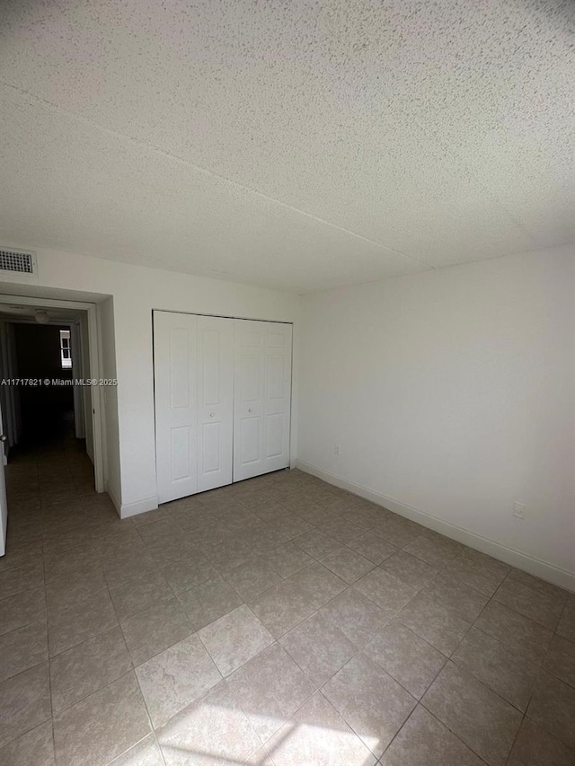 unfurnished bedroom featuring a closet