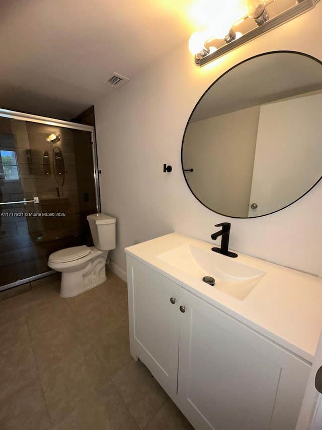 bathroom with vanity, toilet, and walk in shower