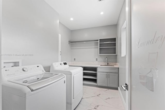 laundry room with washer and clothes dryer and sink