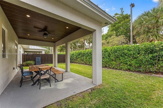 view of patio featuring ceiling fan