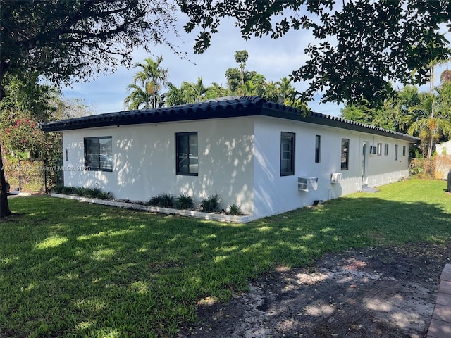 view of property exterior featuring a yard