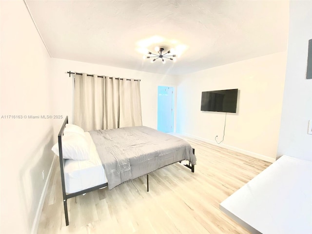 bedroom with wood-type flooring