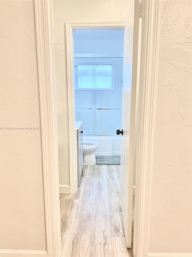 hall featuring light hardwood / wood-style flooring