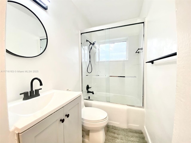 full bathroom featuring vanity, toilet, and enclosed tub / shower combo