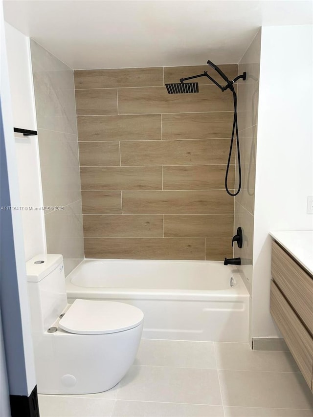 full bathroom with tile patterned floors, vanity, toilet, and tiled shower / bath