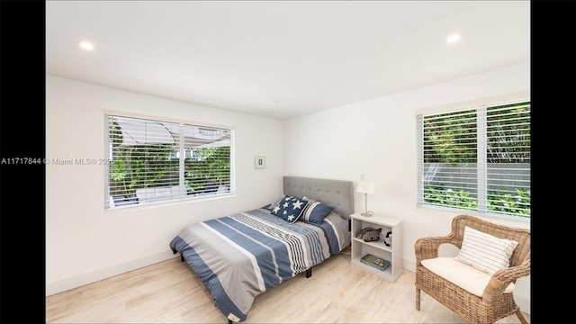 bedroom with light hardwood / wood-style floors