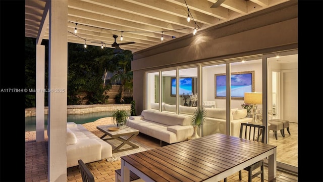 view of patio with outdoor lounge area and ceiling fan