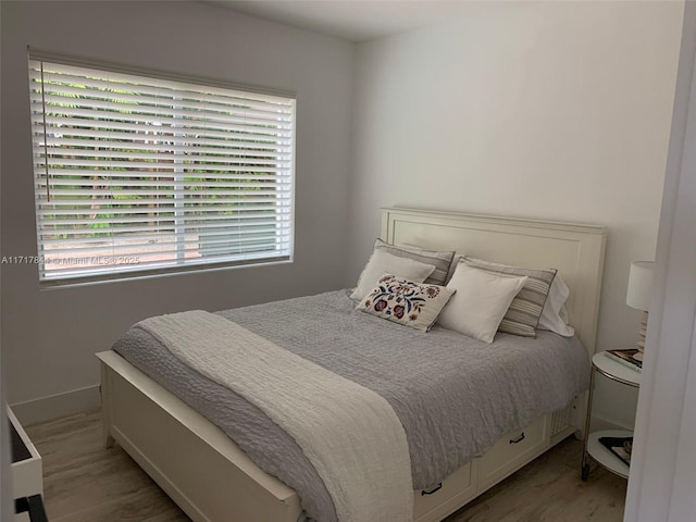 bedroom featuring hardwood / wood-style floors