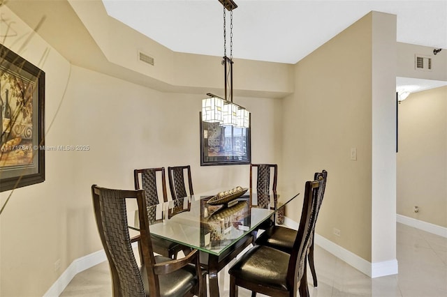 dining area with light tile patterned flooring