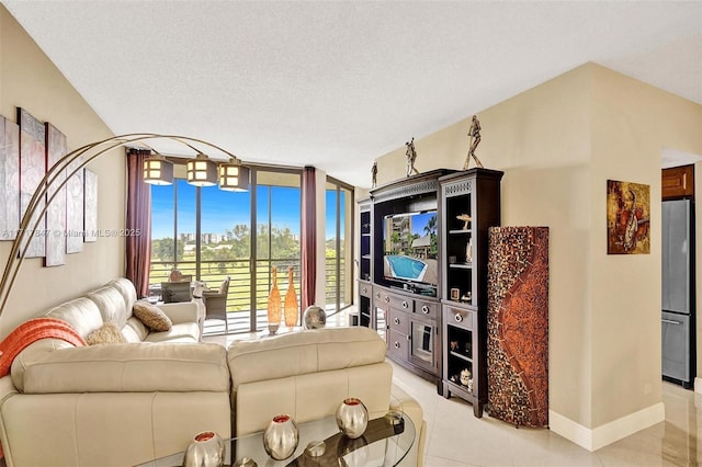 tiled living room with expansive windows and a textured ceiling