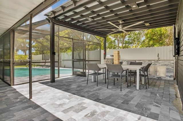 view of patio with a fenced in pool, area for grilling, a grill, and a lanai