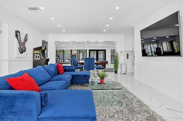 living room featuring crown molding